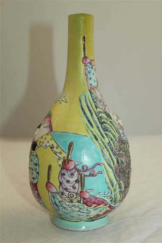 A Chinese moulded and enamelled biscuit porcelain bottle vase, Qianlong seal mark, 19th century, 22.5cm, neck restored